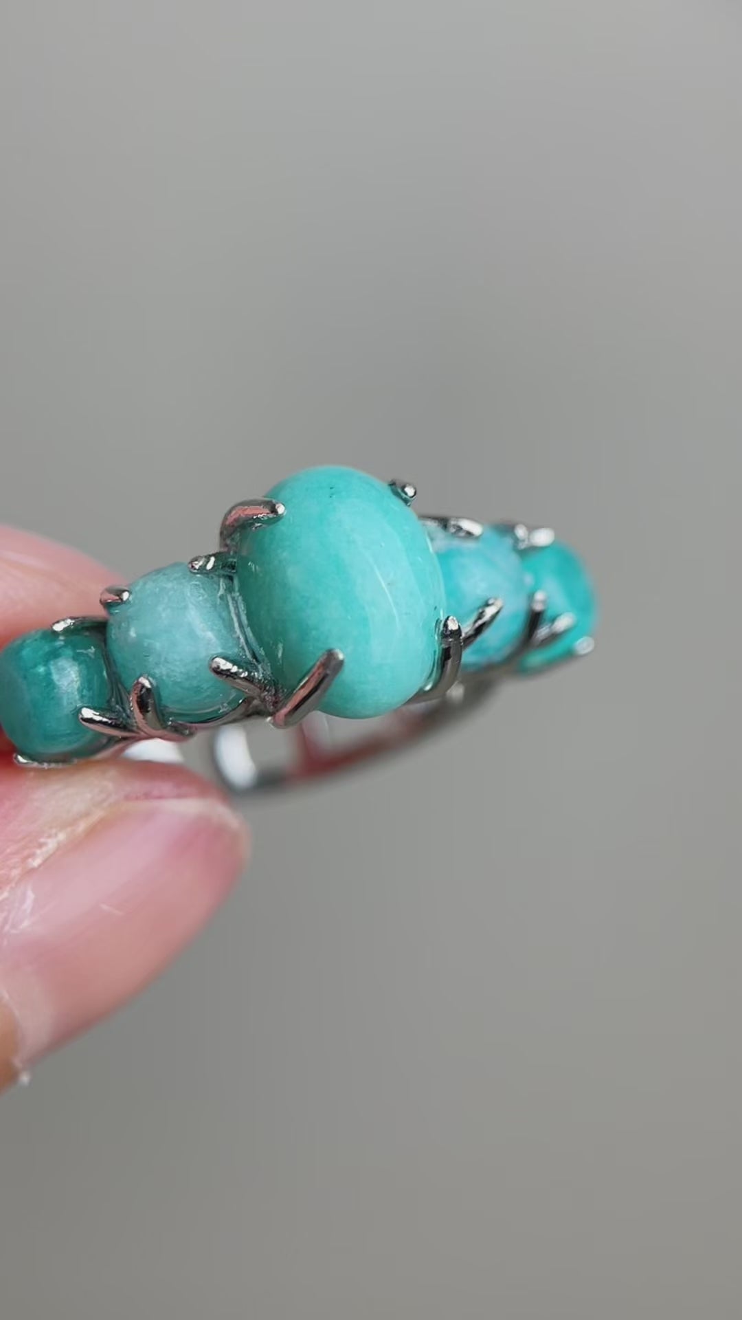Video of amazonite band ring showing polished blue green stones and row setting