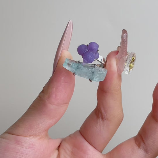 Video of purple grape agate and aquamarine ring showing rounded purple agate and hexagonal blue aquamarine crystal