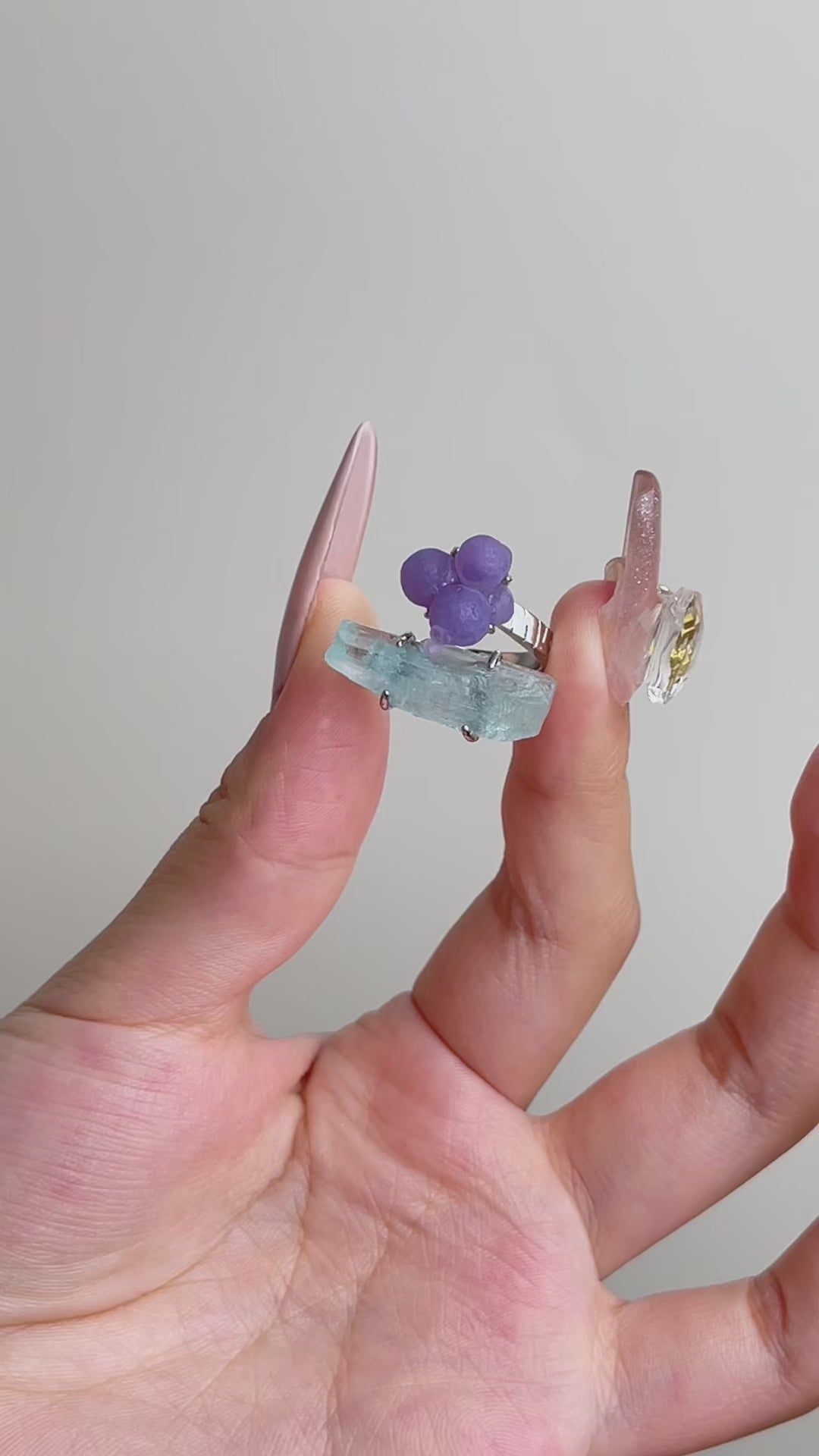 Video of purple grape agate and aquamarine ring showing rounded purple agate and hexagonal blue aquamarine crystal