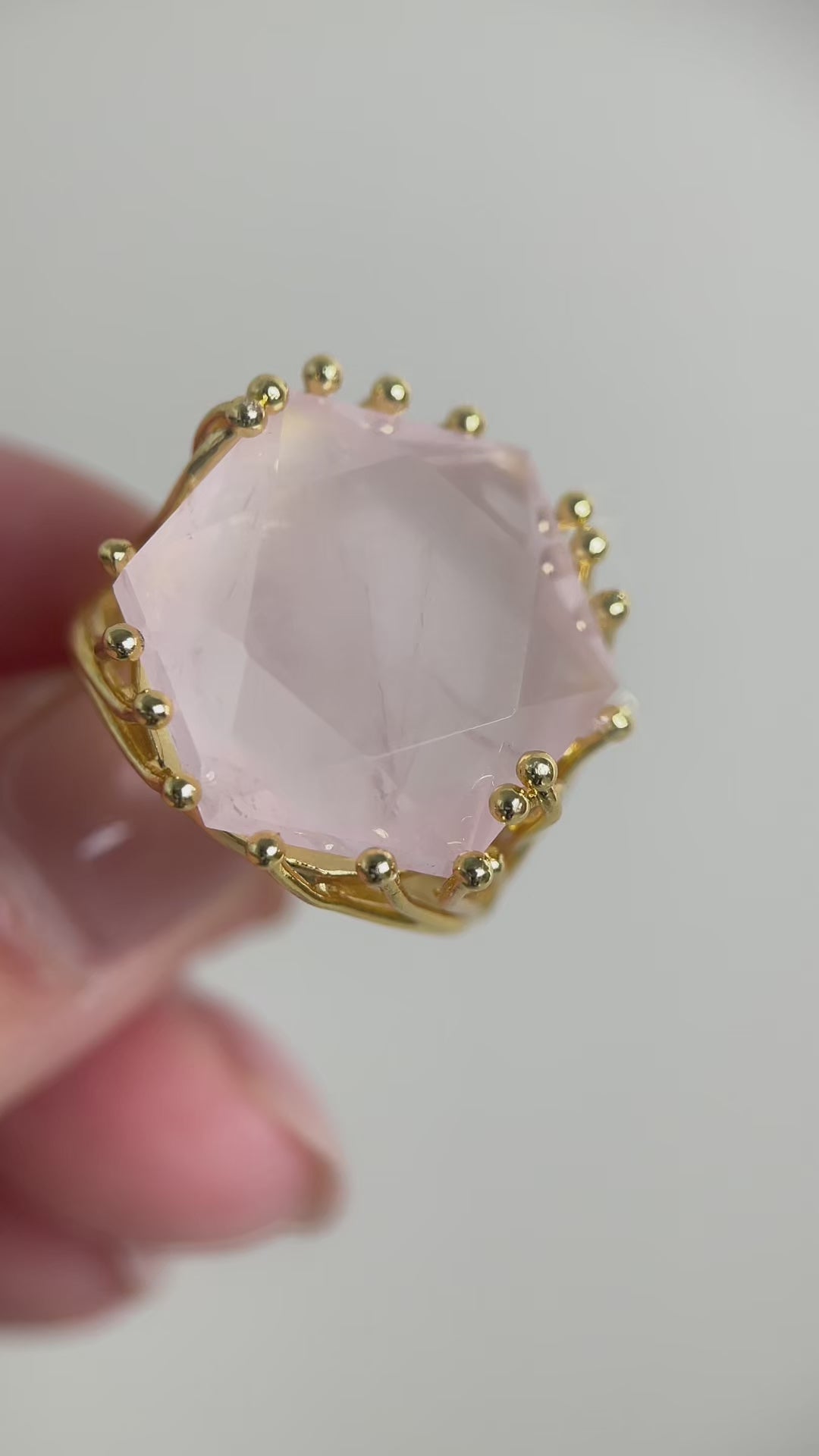 Rose quartz hexagon star cut ring featuring soft pink tones and geometric faceting, a refined crystal jewelry piece symbolizing love and gentle energy