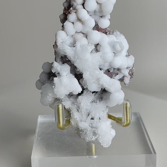 Botryoidal calcite with radiating aragonite texture detail video, showing natural spherical calcite formations with radiating crystal structure, a unique mineral specimen for collectors and display.