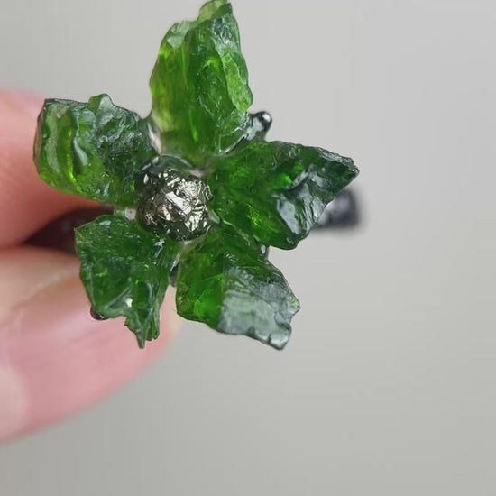 Video of Raw Chrome Diopside and Chalcopyrite flower ring showing deep green crystal flower detail