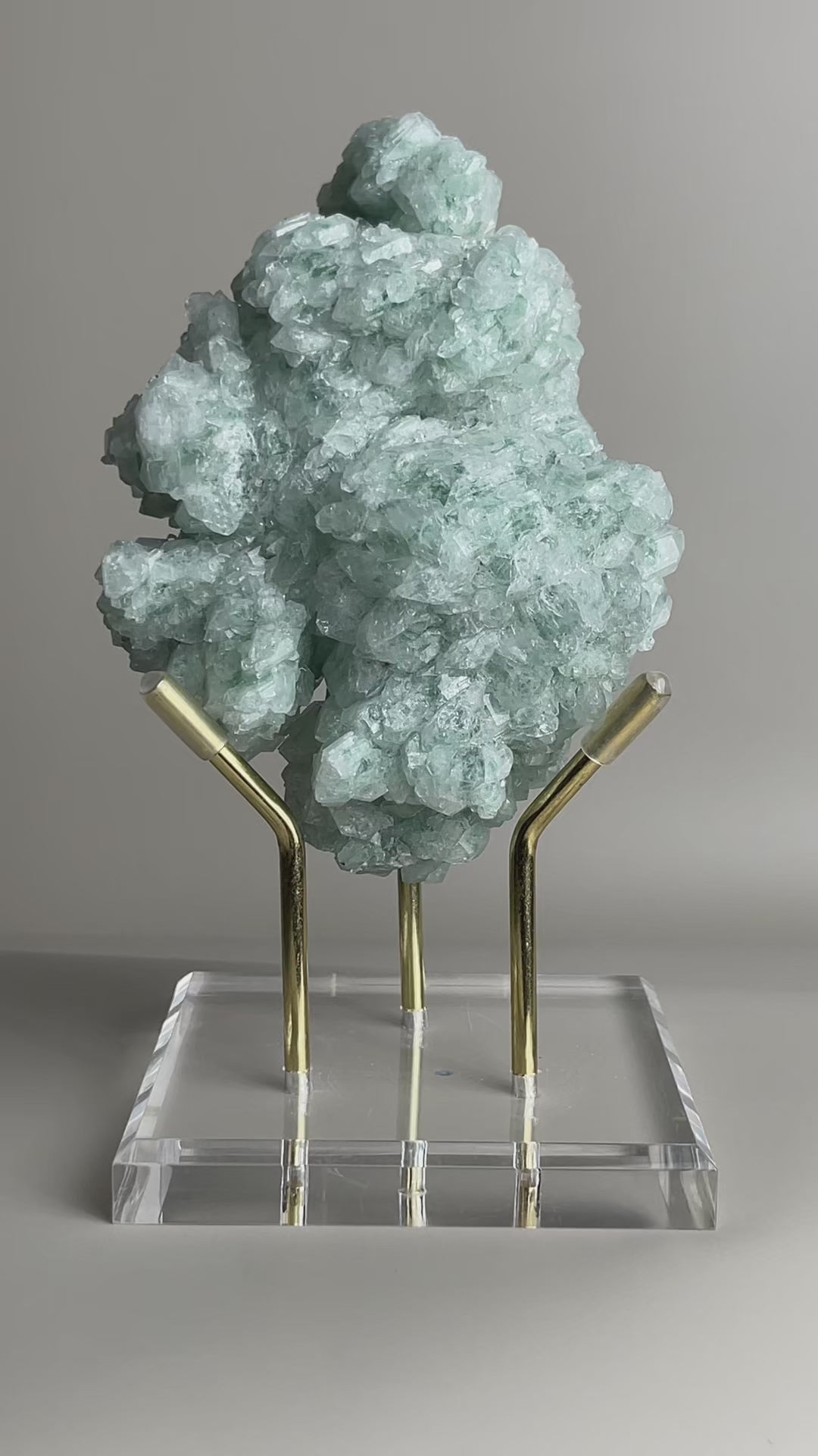 rotating green strawberry quartz cluster showing internal inclusions and crystal structure