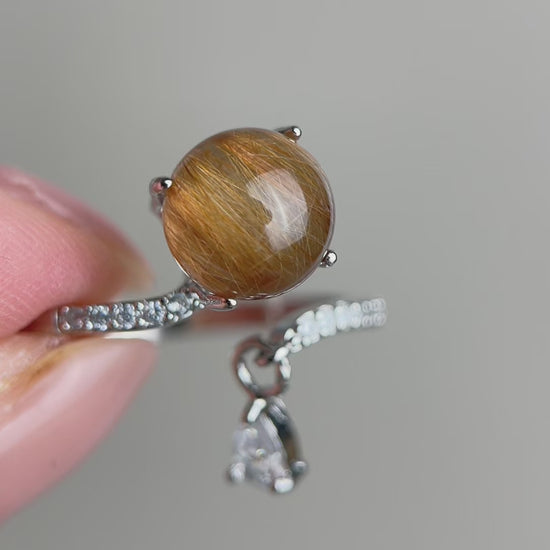 Video of copper rutilated quartz ring showing internal golden threads
