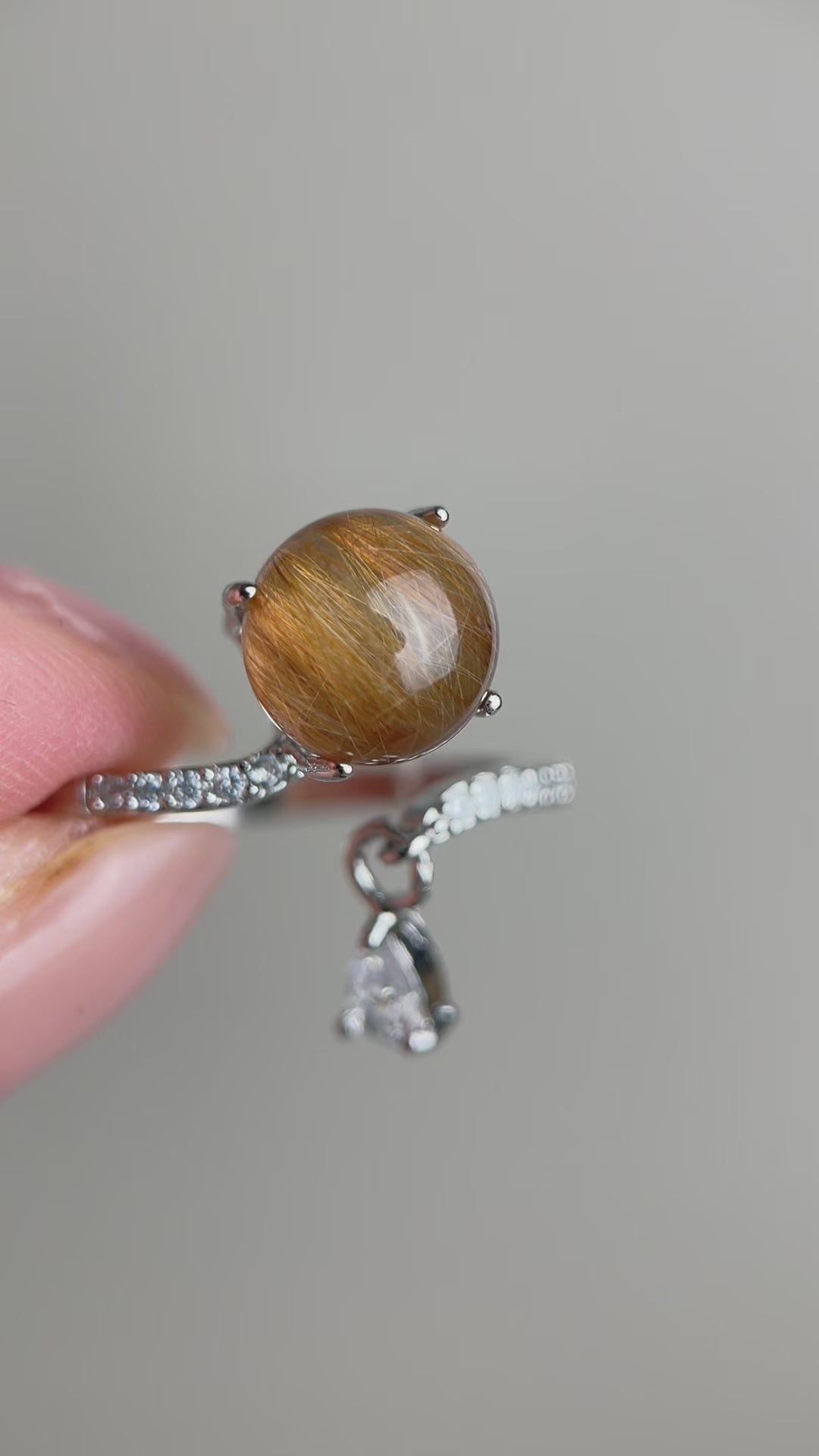 Video of copper rutilated quartz ring showing internal golden threads