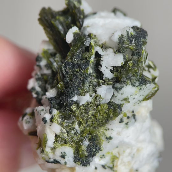Green tourmaline with feldspar mineral specimen video