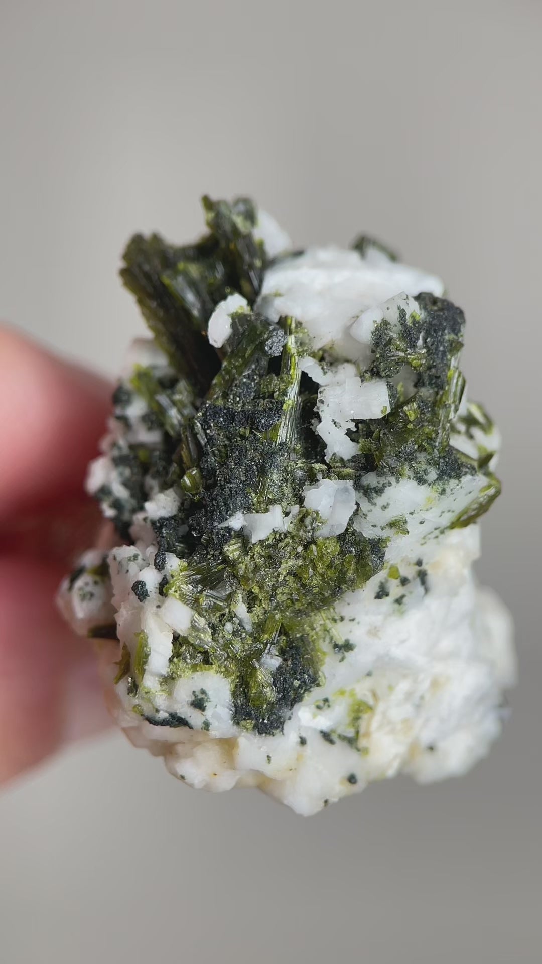 Green tourmaline with feldspar mineral specimen video