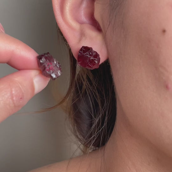 Video of raw Sri Lankan garnet stud earrings in natural crystal form