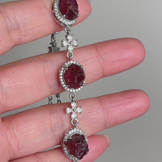 Video of raw garnet bracelet showing deep red natural crystal texture and organic bead formation
