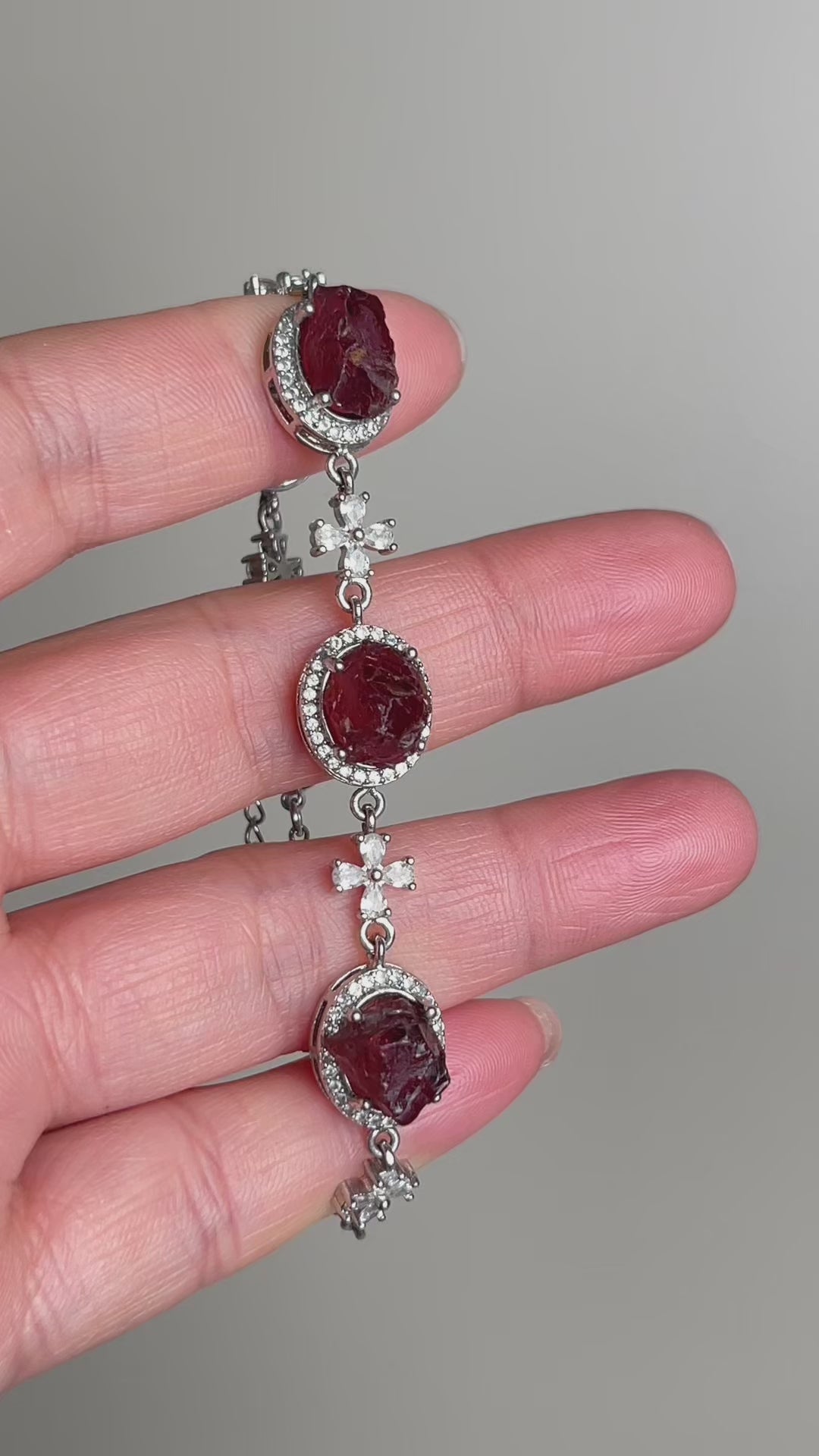 Video of raw garnet bracelet showing deep red natural crystal texture and organic bead formation
