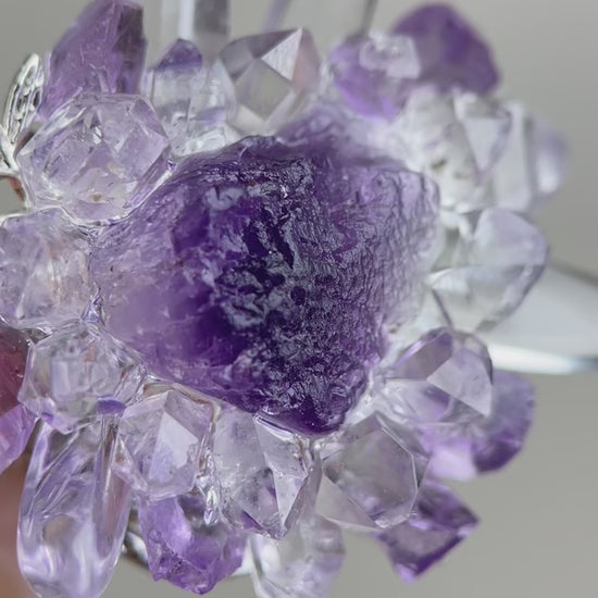 Video of raw Purple Fluorite, Amethyst, Herkimer Diamond Quartz, Lemurian Seed Quartz and Clear Quartz ring