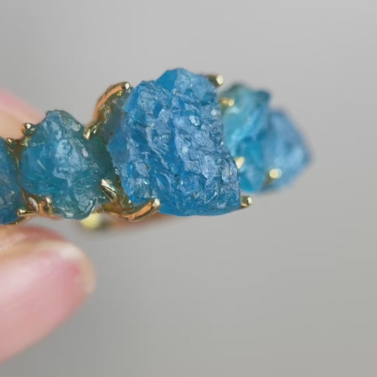 Video of Raw Blue Apatite row ring showing vivid blue crystal detail