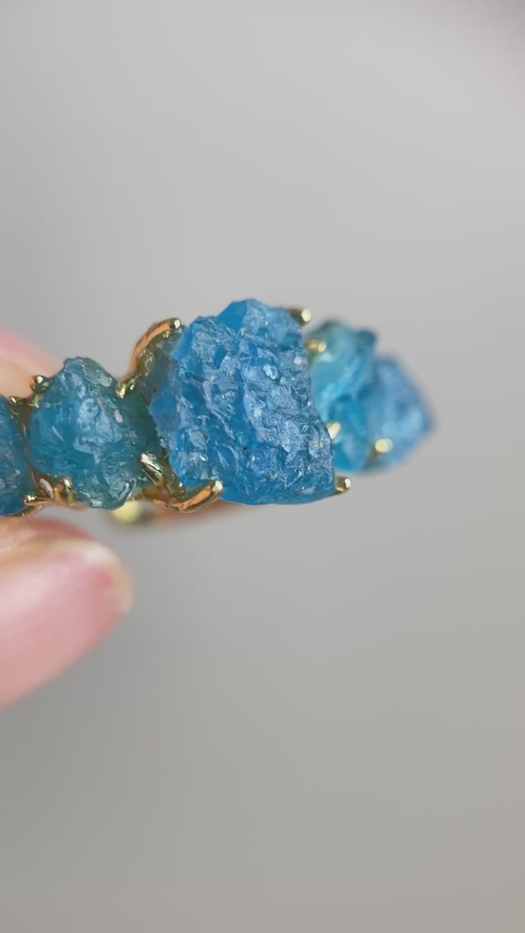 Video of Raw Blue Apatite row ring showing vivid blue crystal detail