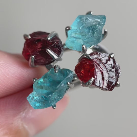 Video of Raw Garnet and Blue Apatite ring showing red and blue natural crystals
