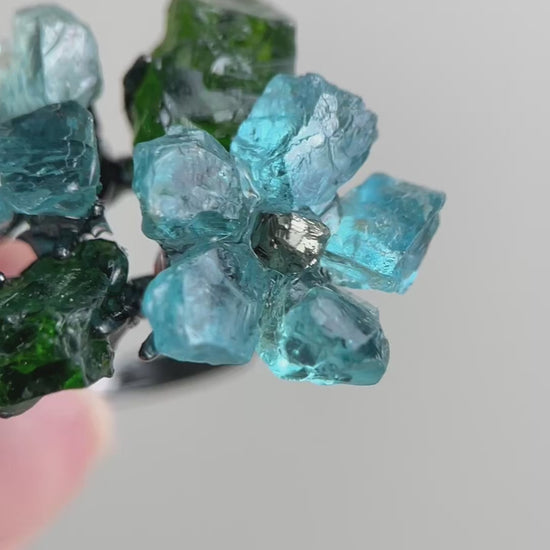 Video of Raw Blue Apatite flower ring with Chalcopyrite center and Chrome Diopside stones