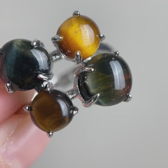 Video of tiger’s eye and blue tiger’s eye ring showing moving chatoyancy and polished quartz stones