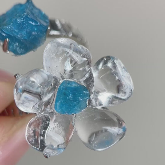 Video of Clear Quartz Flower Ring with polished quartz petals and raw Blue Apatite accents
