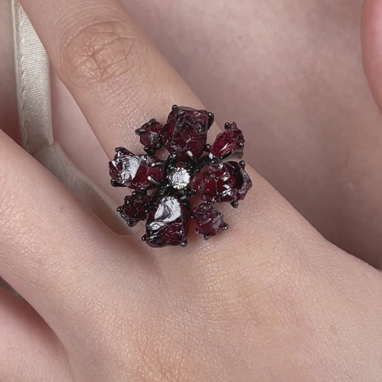 Video of a raw garnet snowflake ring featuring deep red Sri Lankan garnet in a dramatic crystal design