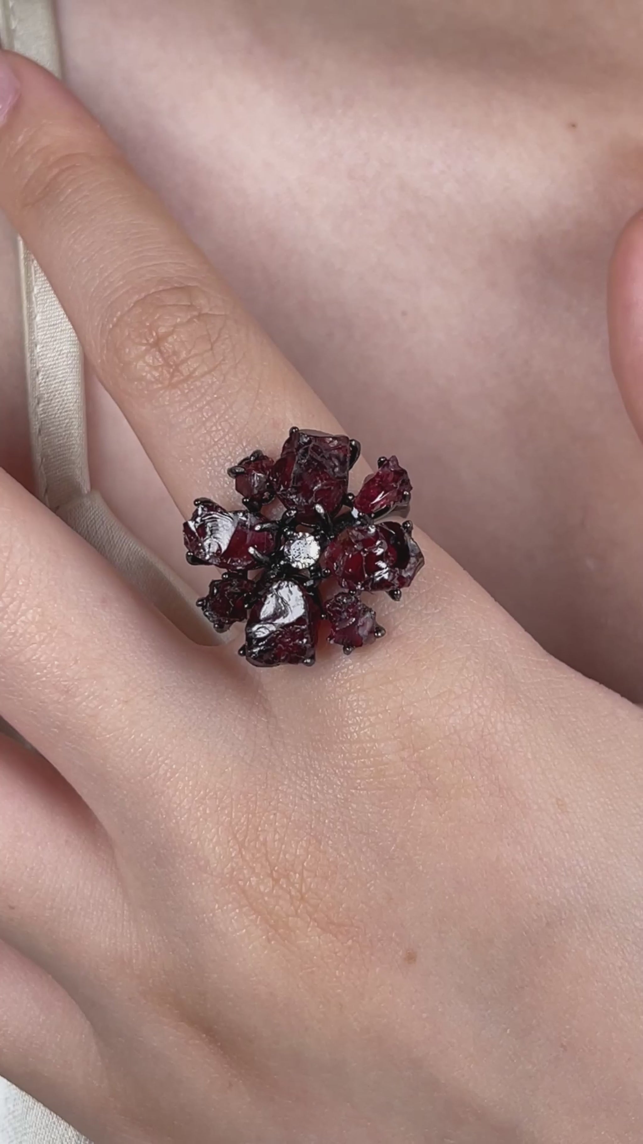 Video of a raw garnet snowflake ring featuring deep red Sri Lankan garnet in a dramatic crystal design