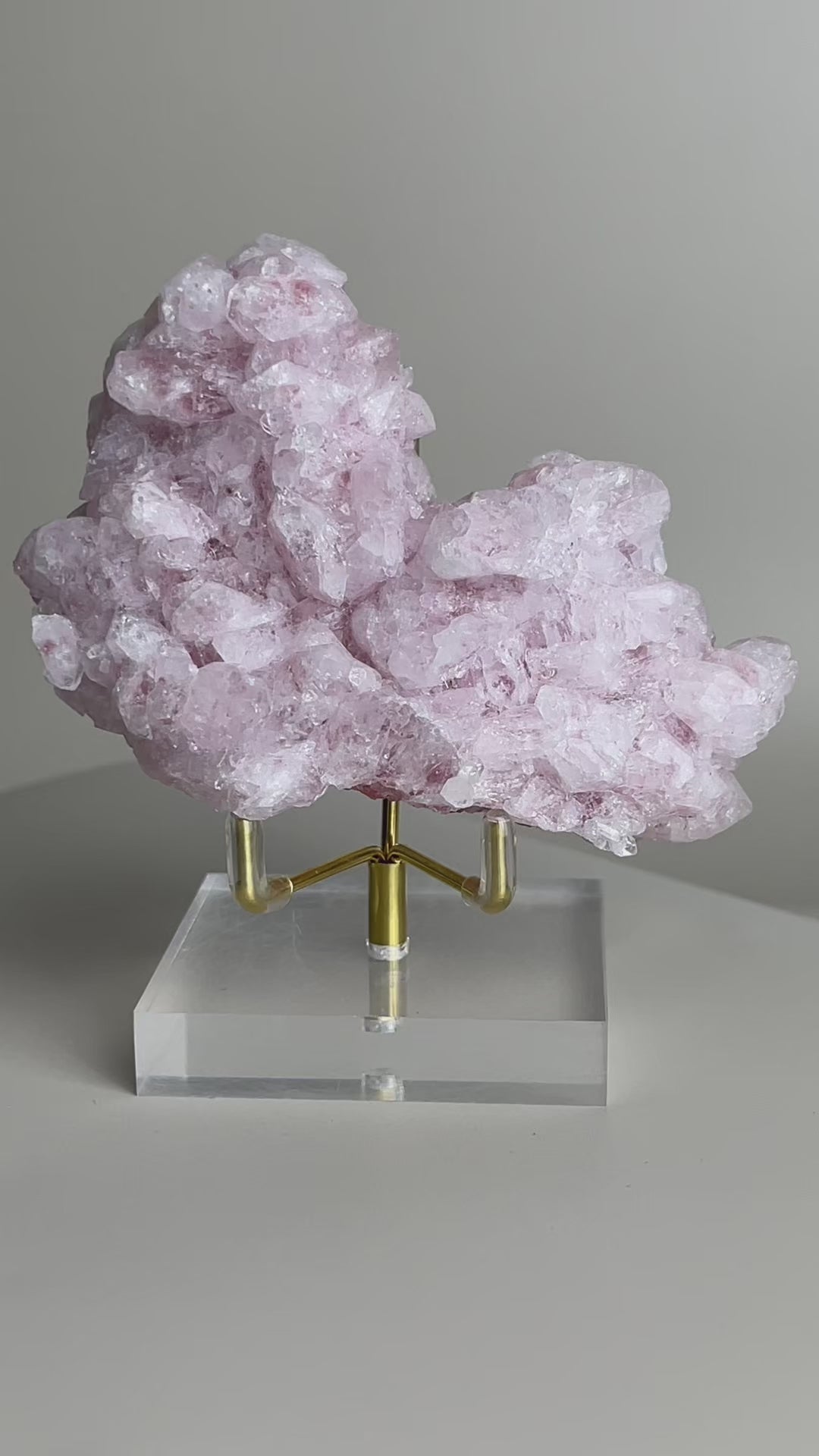 rotating pink strawberry quartz cluster showing internal inclusions and crystal structure