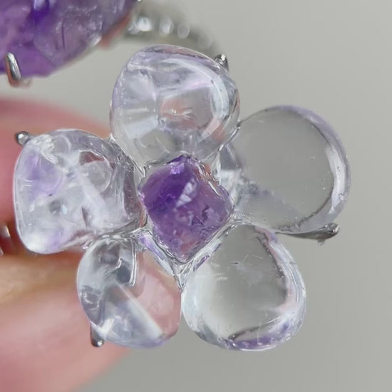 Video of Clear Quartz Flower Ring with polished quartz petals and raw Amethyst accents