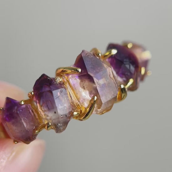 Video of raw Amethyst Super Seven crystal band ring showing purple quartz points