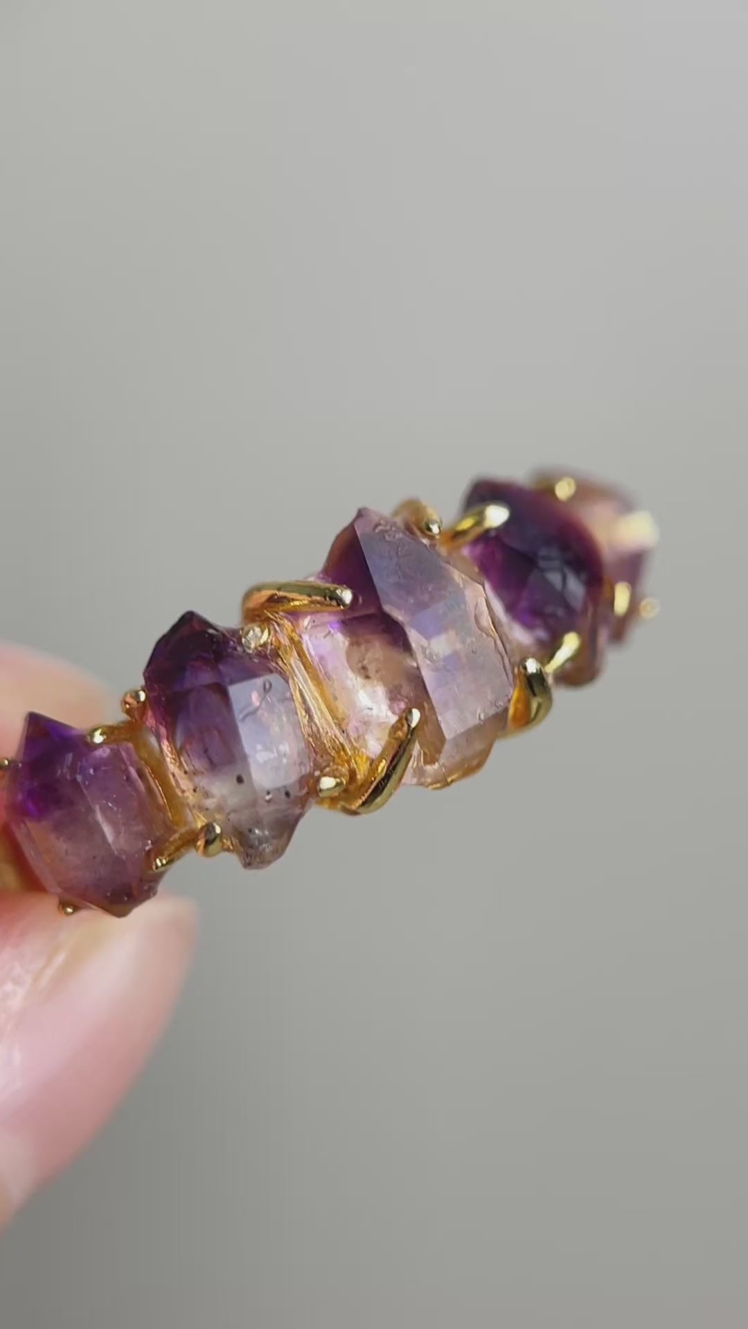 Video of raw Amethyst Super Seven crystal band ring showing purple quartz points