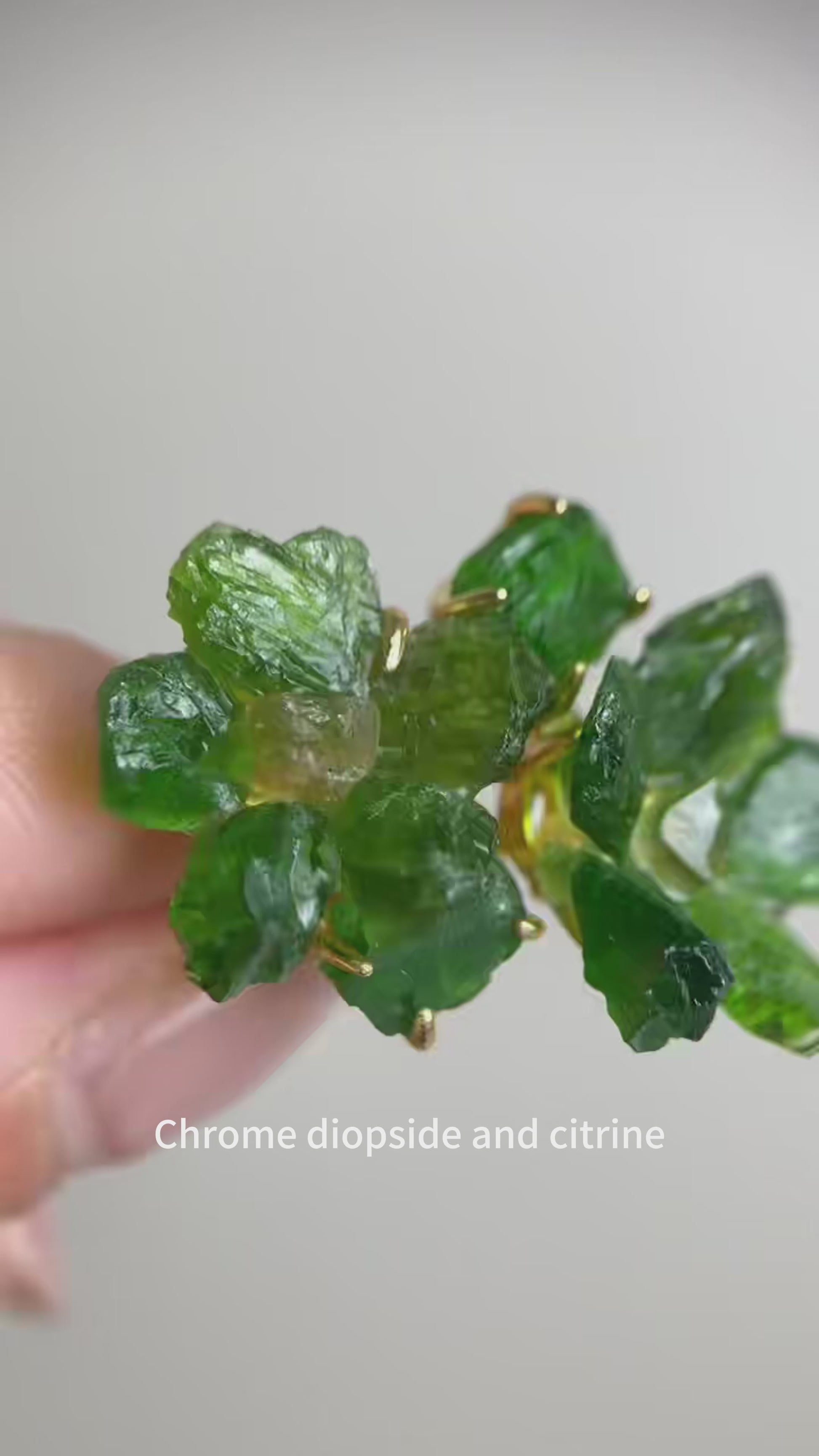 Raw Chrome Diopside flower ring with deep green crystal petals and a natural citrine center, handcrafted mineral specimen jewelry with organic textures and vibrant contrast