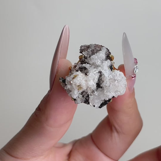 Video of raw Creedite crystal cluster ring showing natural mineral specimen texture