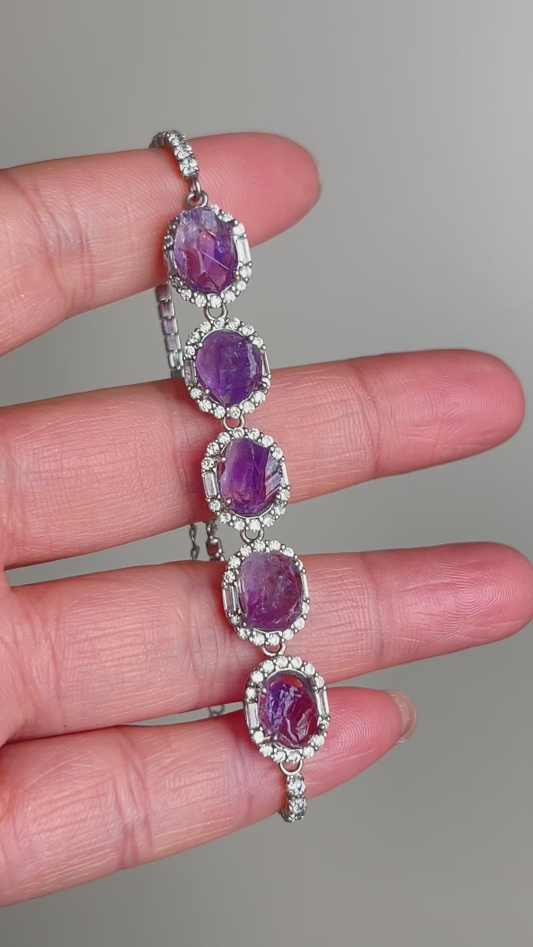 Raw amethyst bracelet worn on wrist in sterling silver