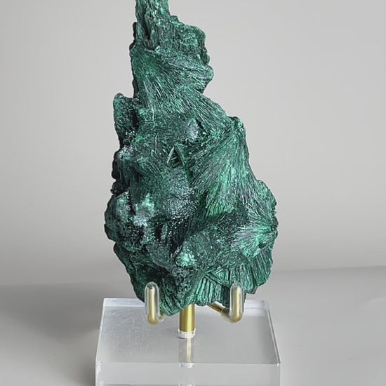 Video of raw fibrous malachite mineral specimen with deep green needle-like crystal texture