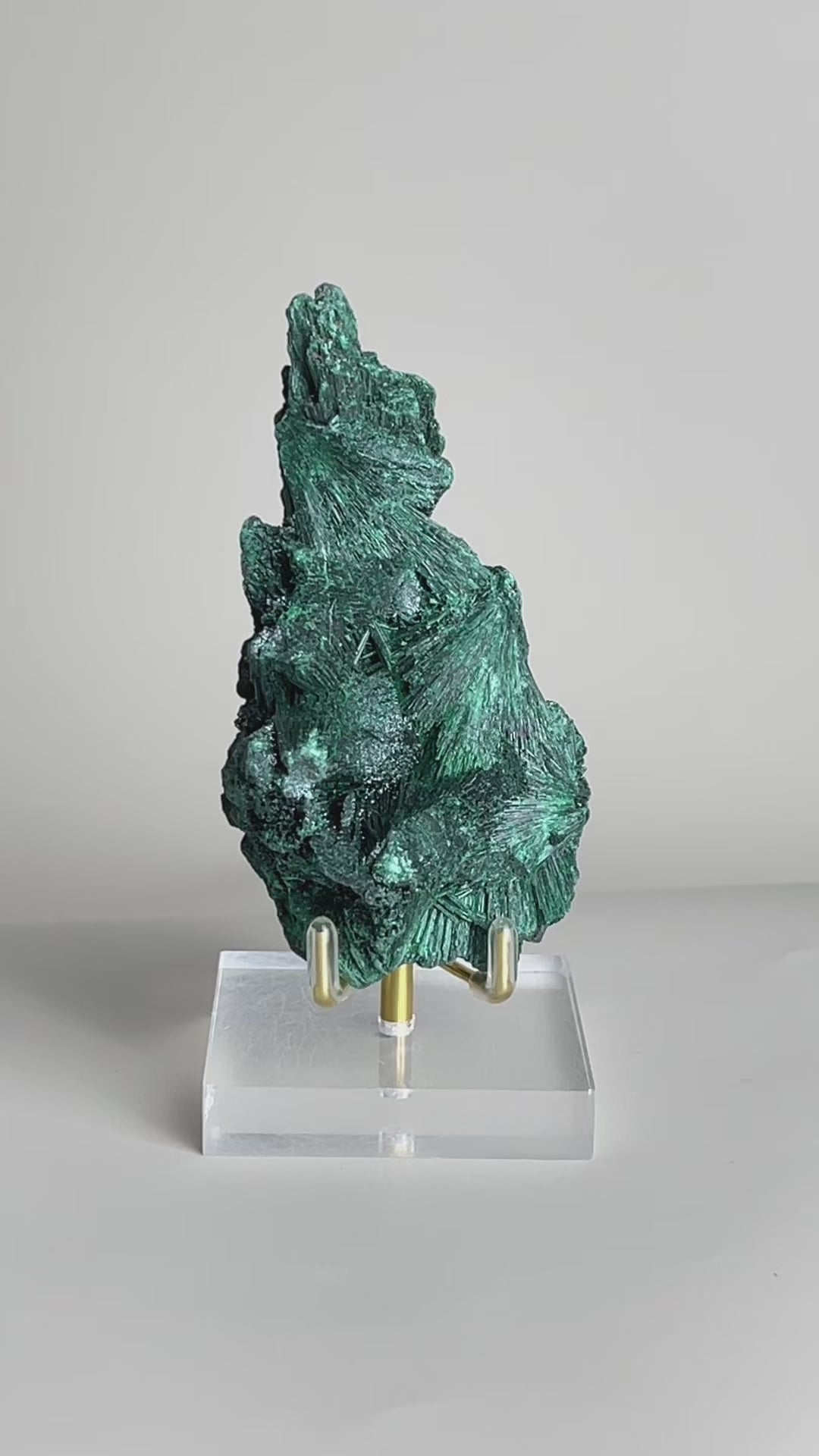 Video of raw fibrous malachite mineral specimen with deep green needle-like crystal texture