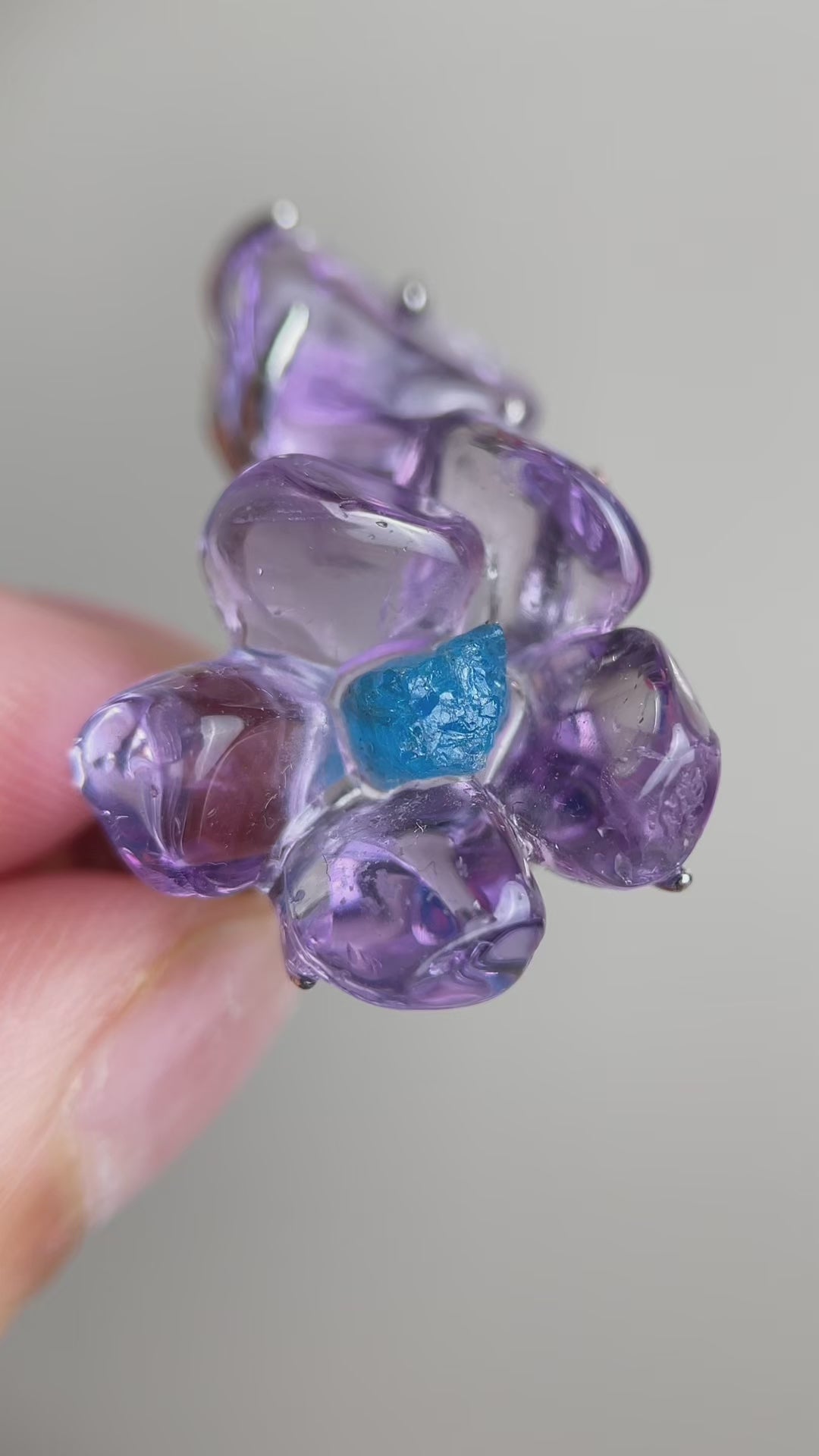 Video of Brazilian amethyst flower ring with blue apatite center