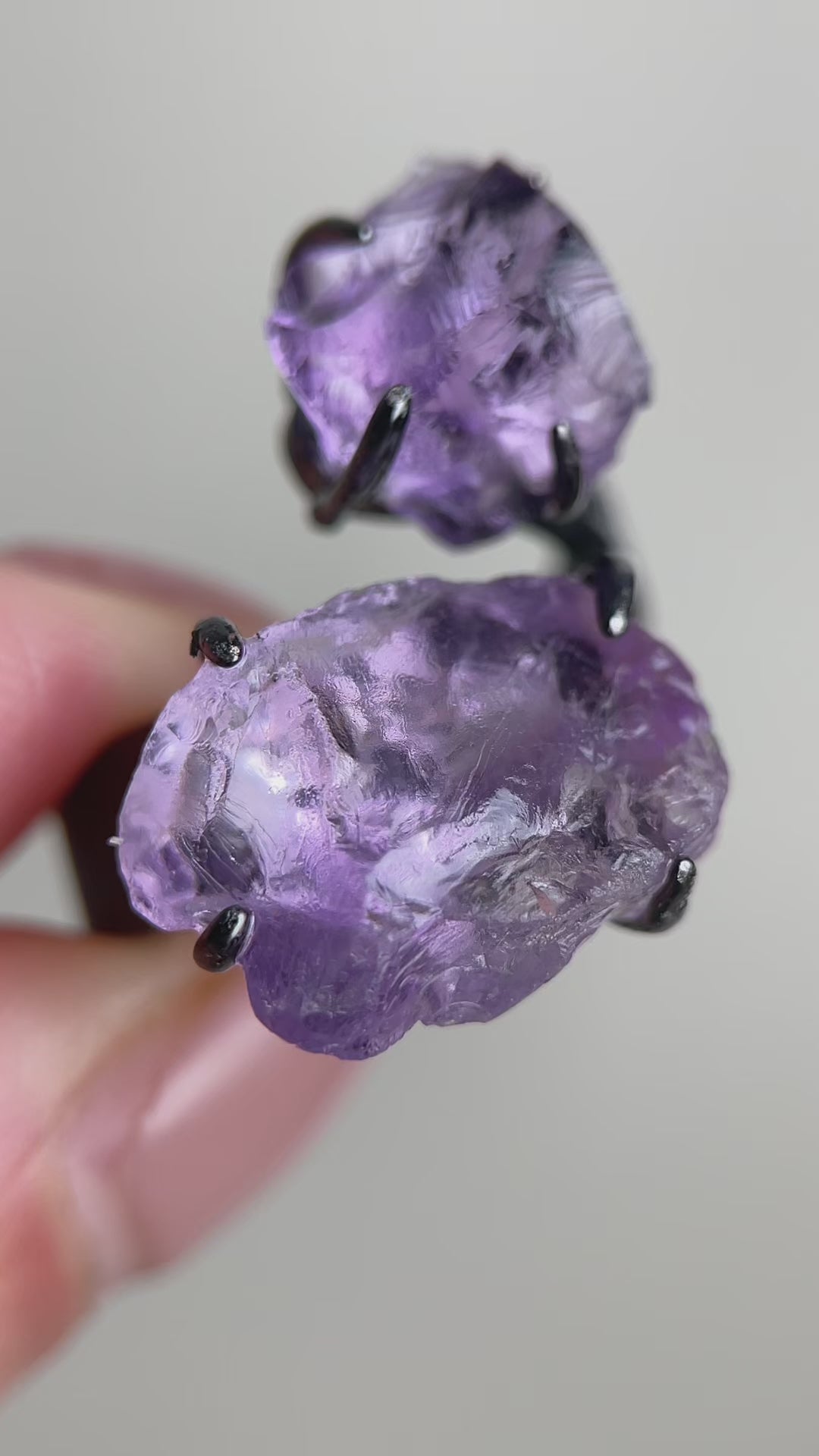 Video of raw Brazilian amethyst ring with natural purple crystal texture