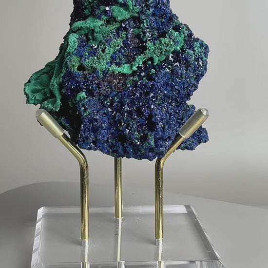 rotating azurite and malachite mineral specimen showing crystal texture and color contrast