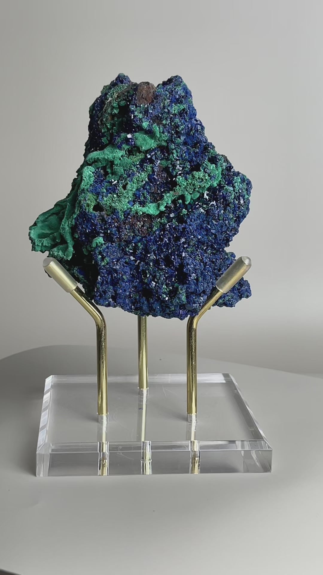 rotating azurite and malachite mineral specimen showing crystal texture and color contrast