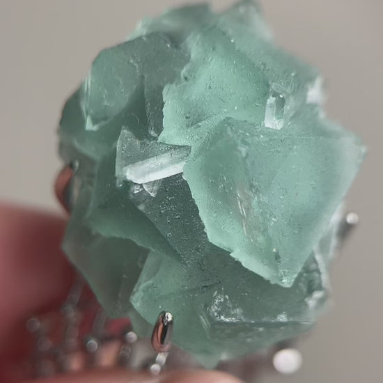 Octahedral green fluorite mineral specimen ring featuring natural geometric crystal formation, a rare raw crystal jewelry piece with collector appeal