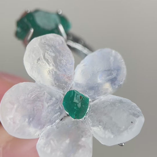 Video of Moonstone and Dioptase crystal flower ring showing soft glow and flower detail