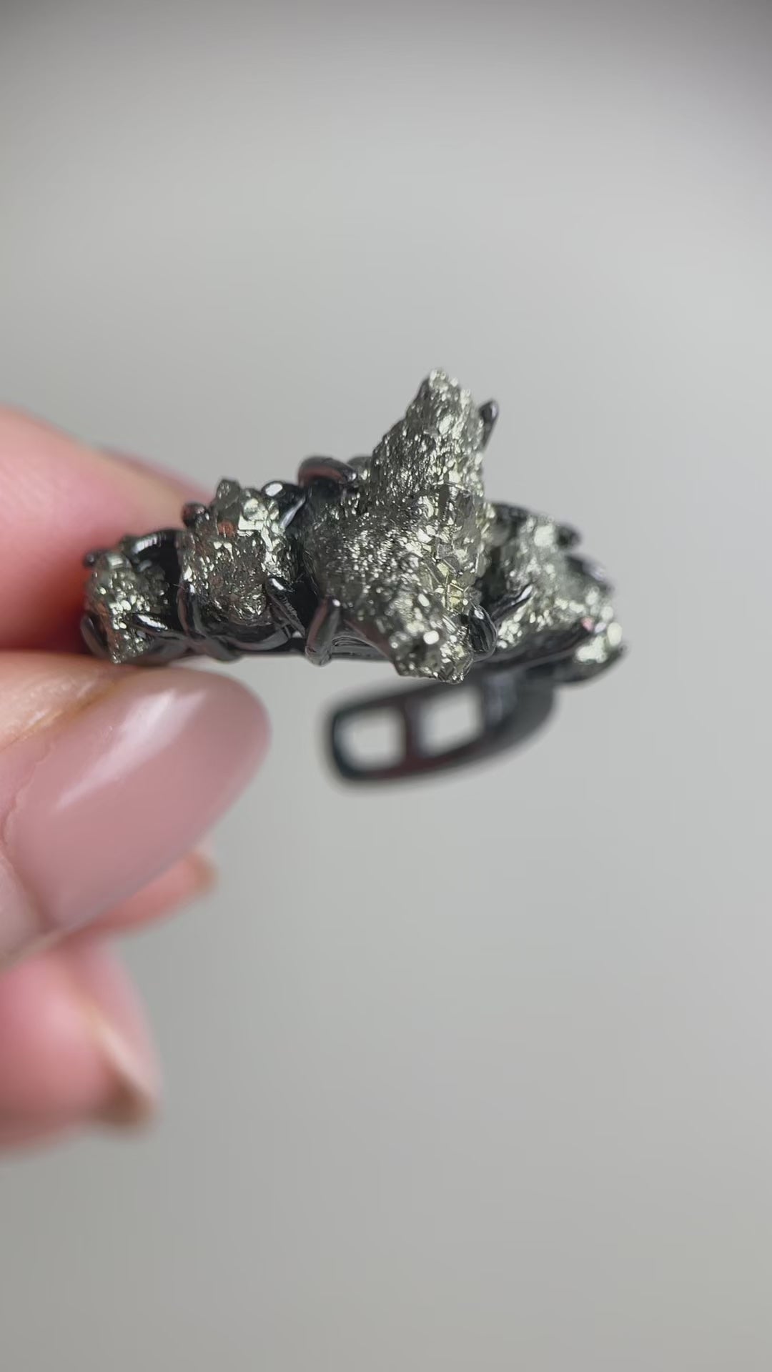 Video of Chalcopyrite row ring showing natural metallic iridescent crystal surface and band design
