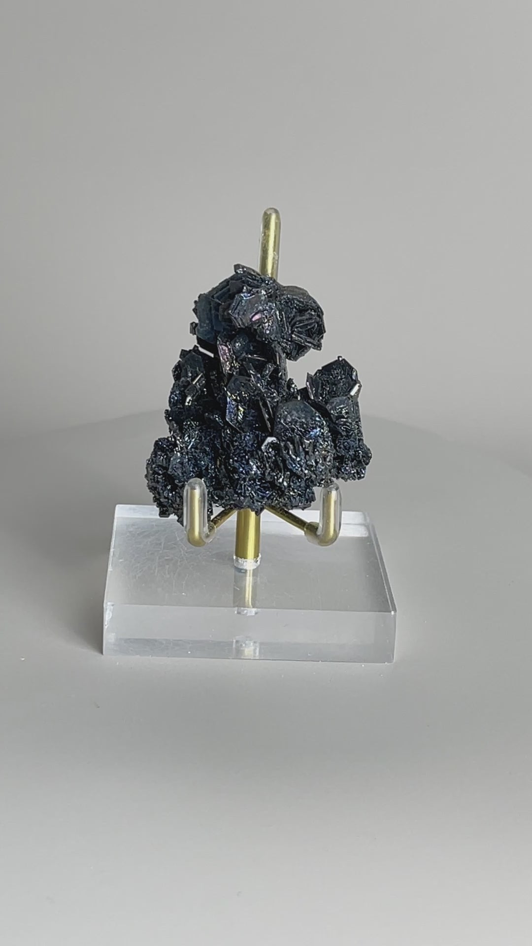 Video of Rainbow Carborundum cluster mineral specimen showing iridescent metallic crystal reflections from different angles.