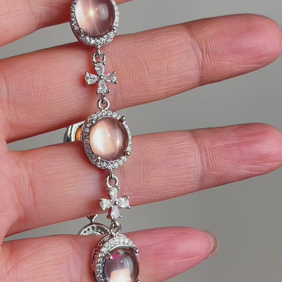 Video of star rose quartz bracelet showing soft pink tone and subtle star-like light effect in natural crystal jewelry design