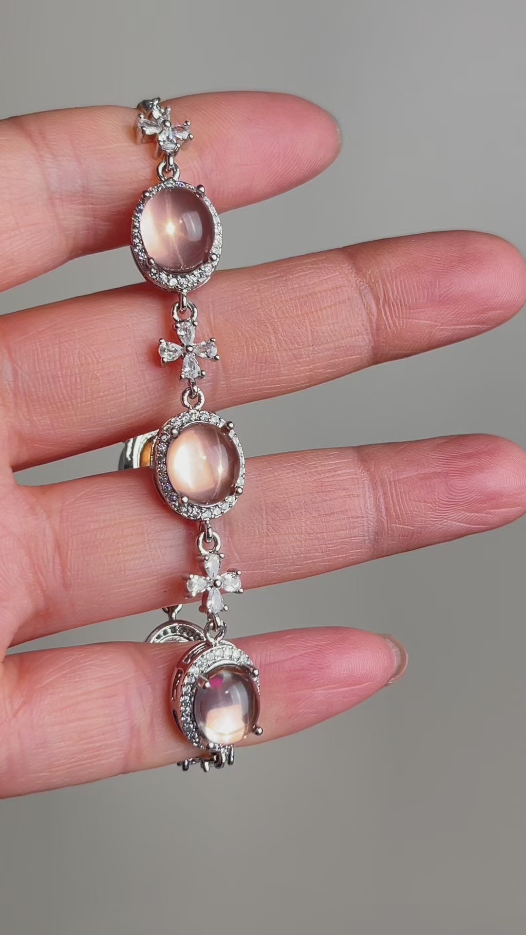 Video of star rose quartz bracelet showing soft pink tone and subtle star-like light effect in natural crystal jewelry design