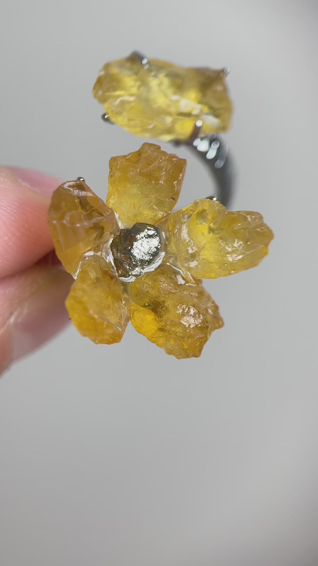 Video of raw citrine flower ring with chalcopyrite center