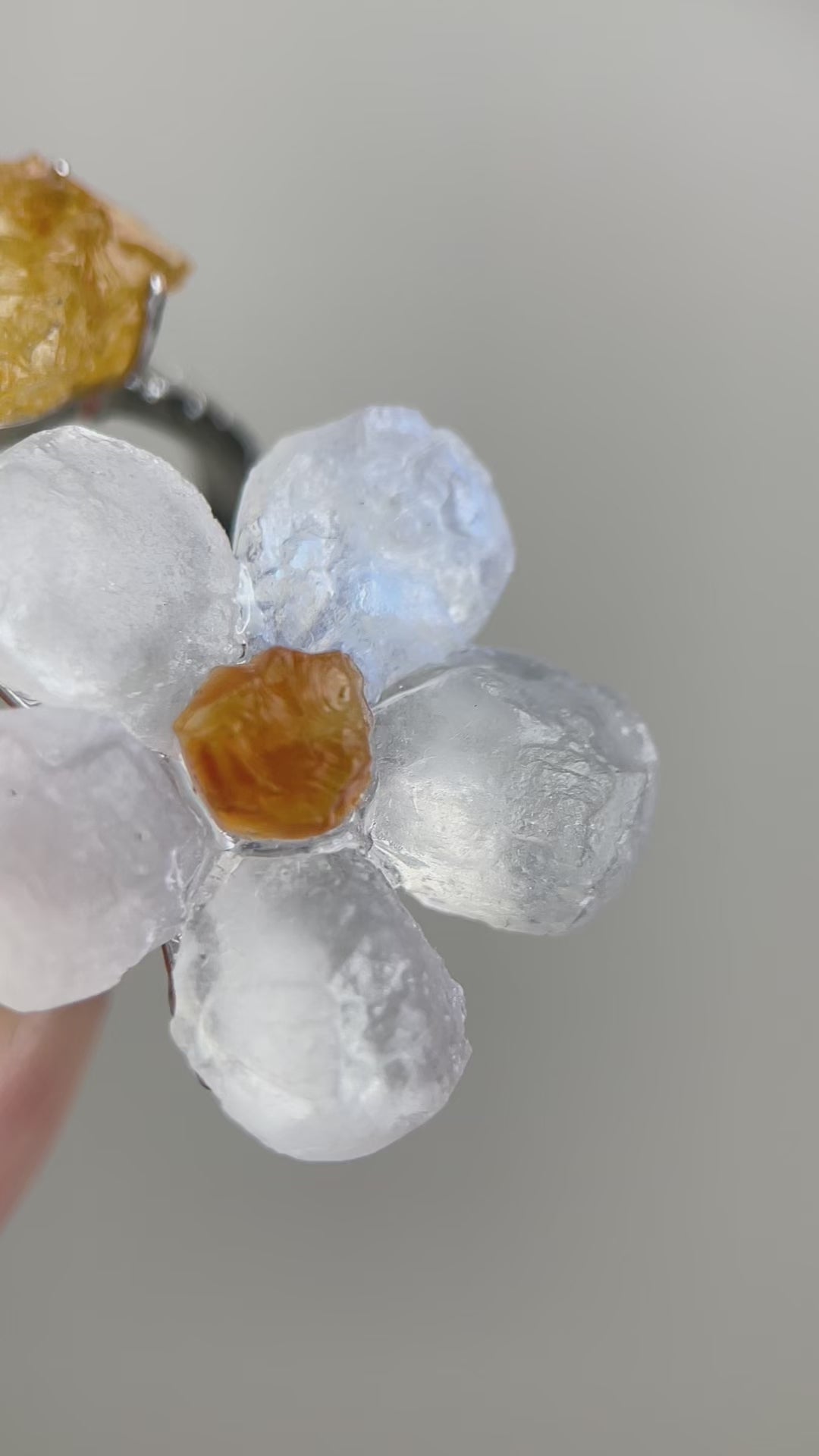 Moonstone flower and citrine two stone ring with natural crystal glow and golden tones, adjustable band, close-up detail video