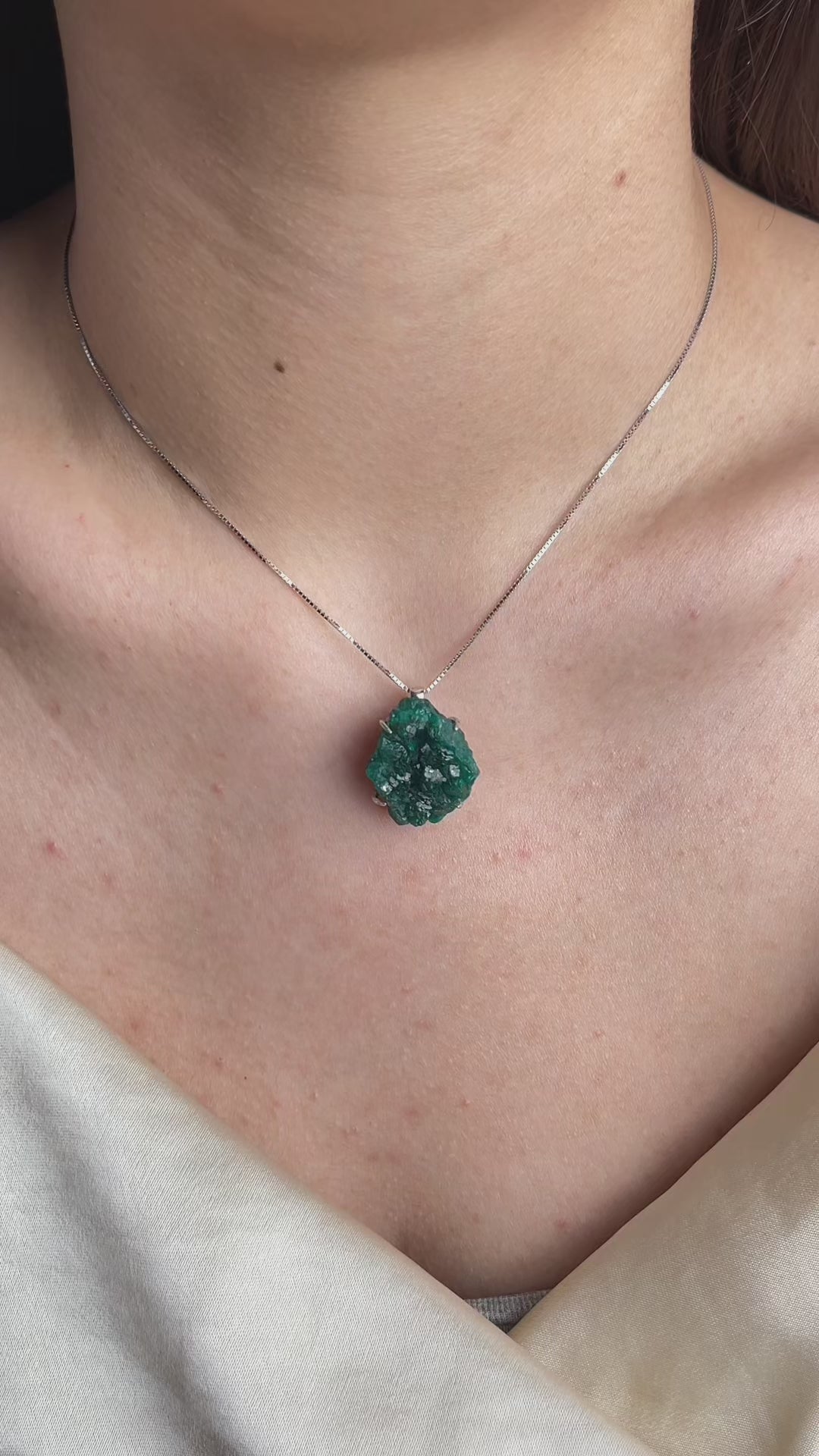 Video of Dioptase necklace in sterling silver showing vivid green crystal and natural texture