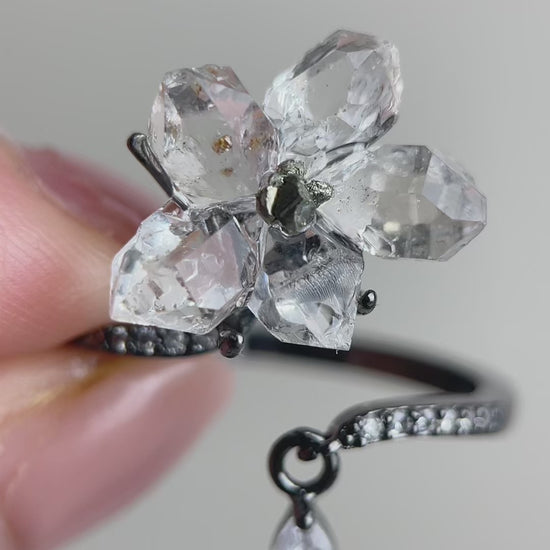 Hakima Diamond Quartz flower ring with clear double-terminated quartz crystals and a Peruvian chalcopyrite center, handcrafted mineral specimen jewelry with natural sparkle and raw texture