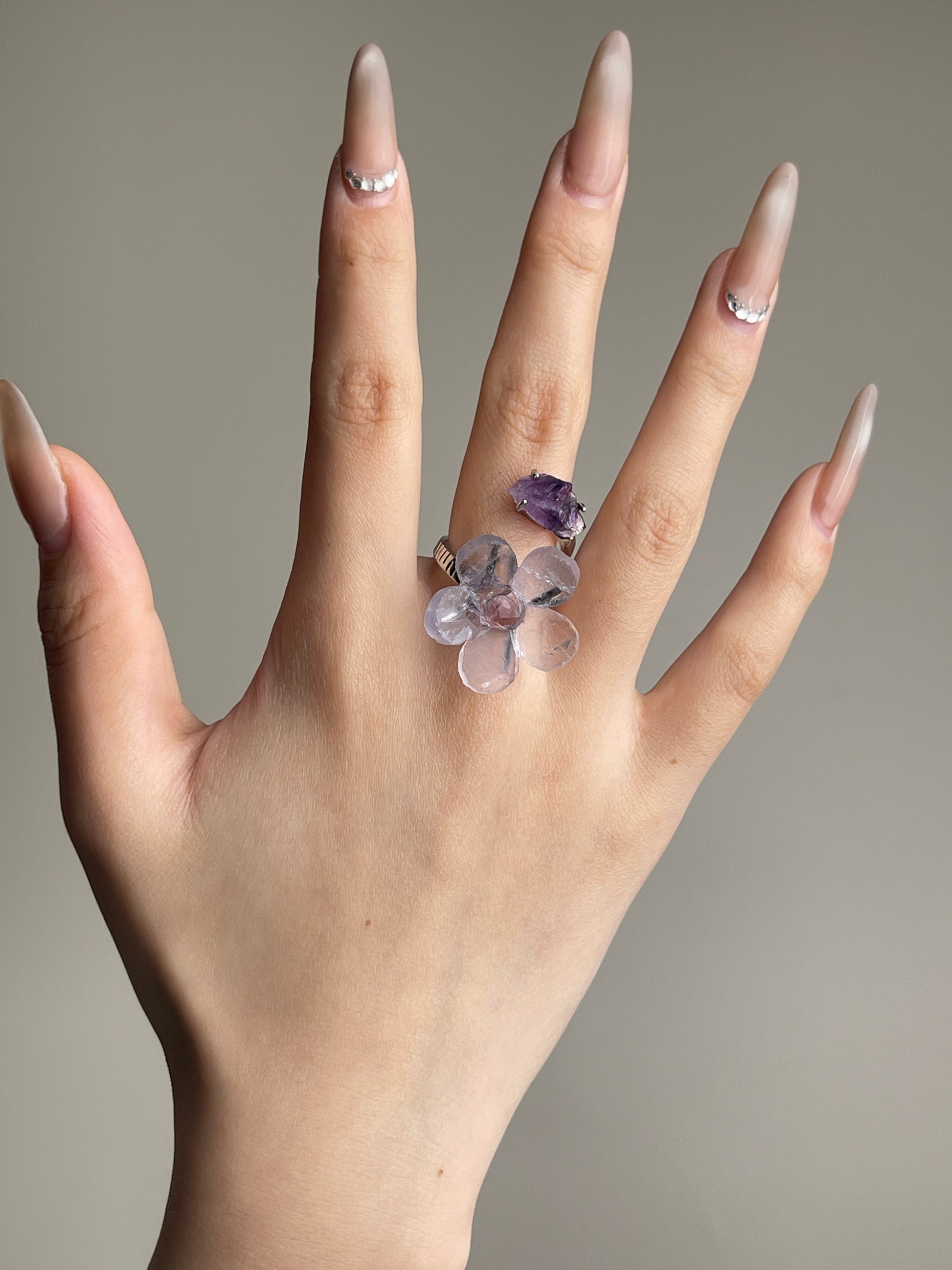 Purple Fluorite and Amethyst crystal flower ring worn on hand