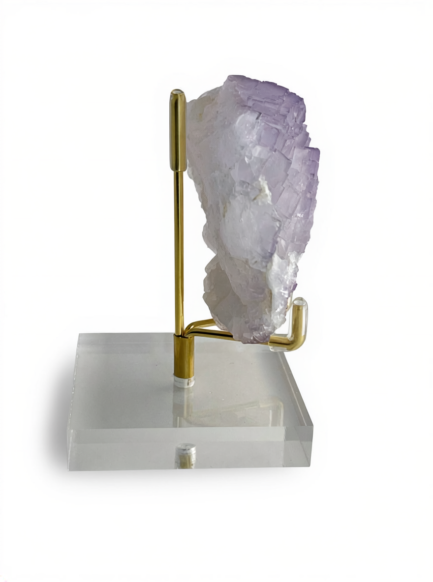 Side view of purple fluorite mineral specimen on matrix showing crystal structure