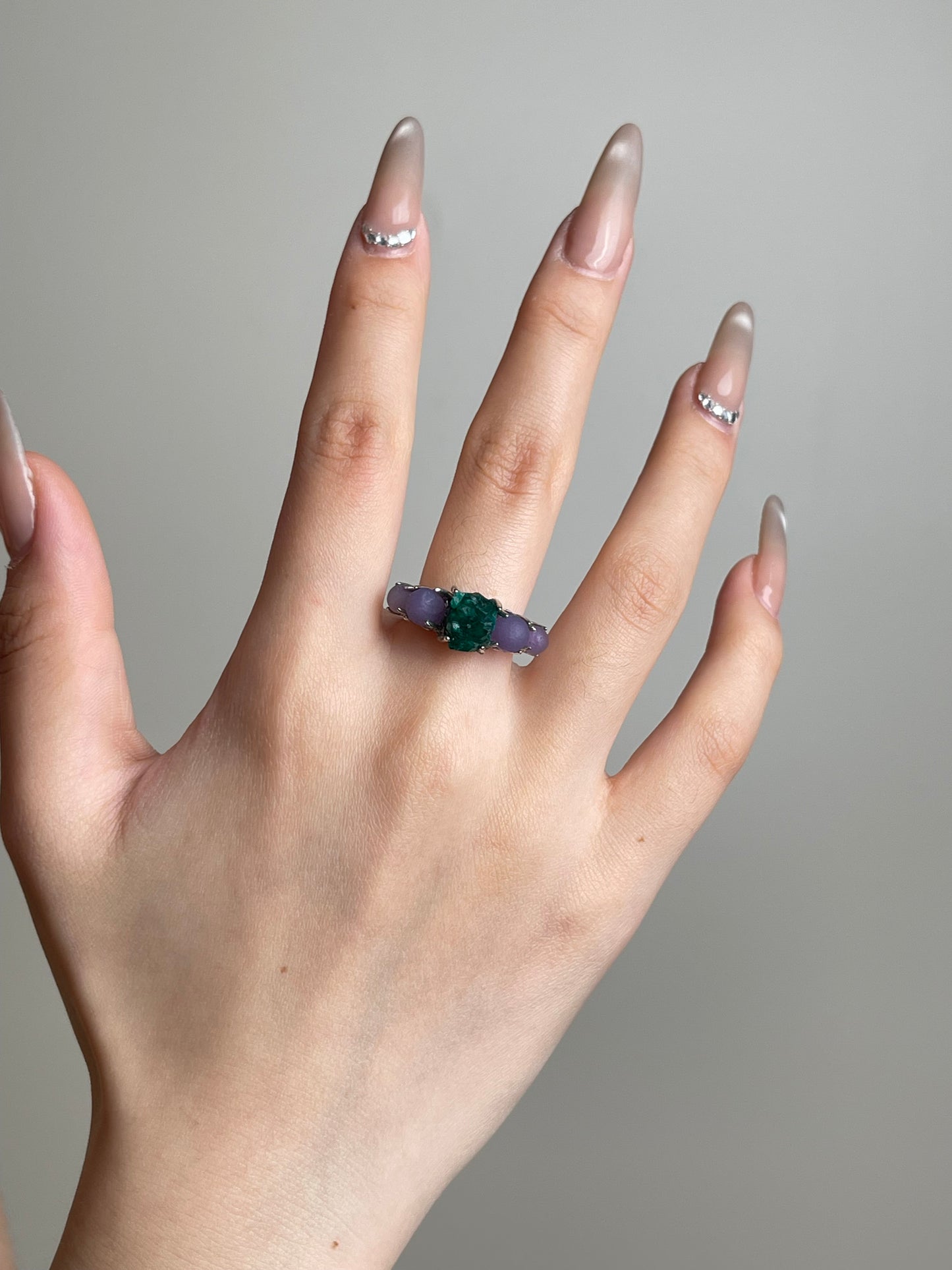 Purple Grape Agate and Dioptase ring worn on hand by Oryssia