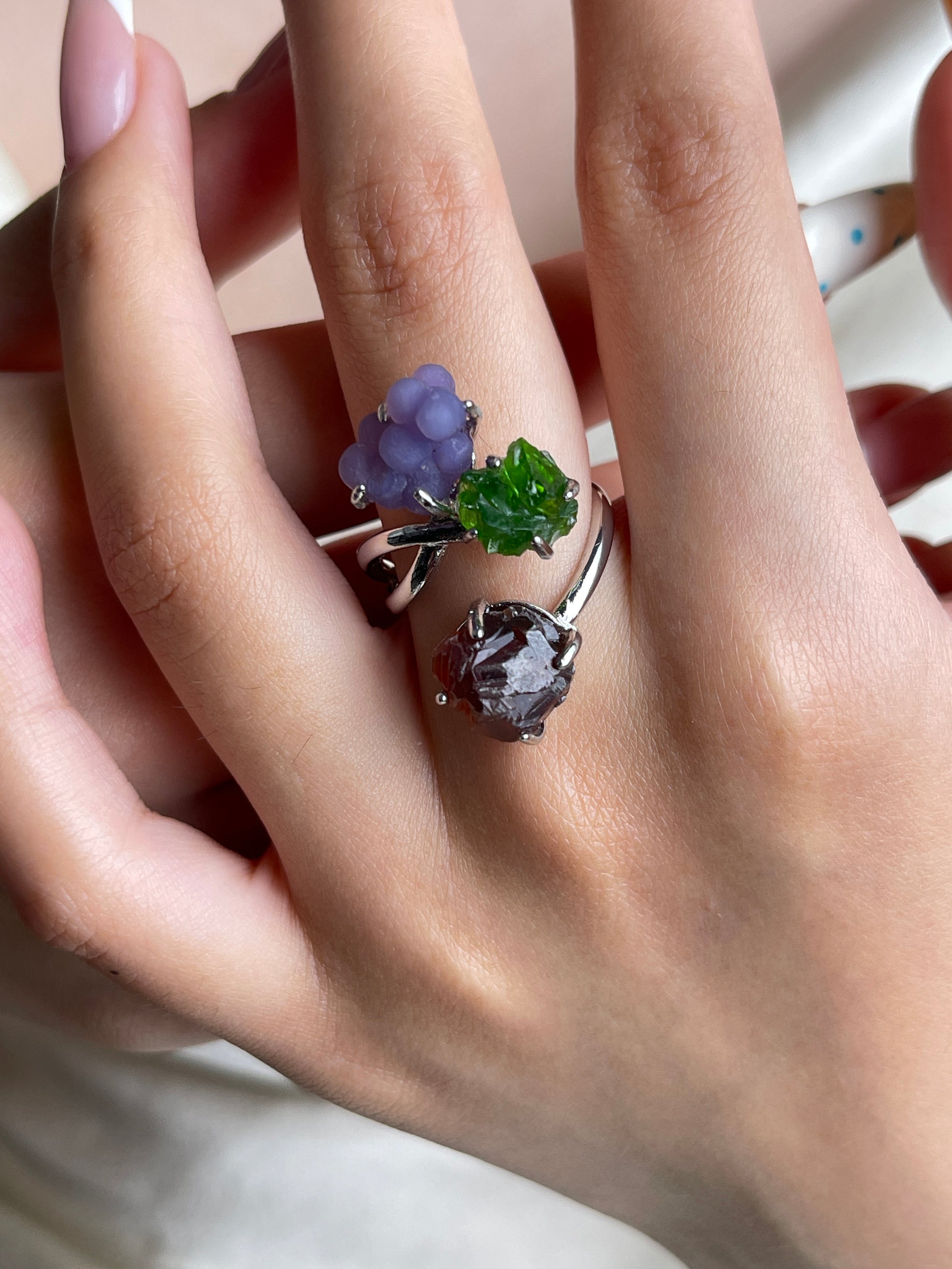 Purple octahedral fluorite crystal ring worn on hand